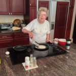 Grandma Making Blueberry Pancakes