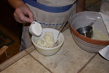 Adding flour to the potatoes