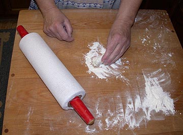 Dusting the potato mixture with flour